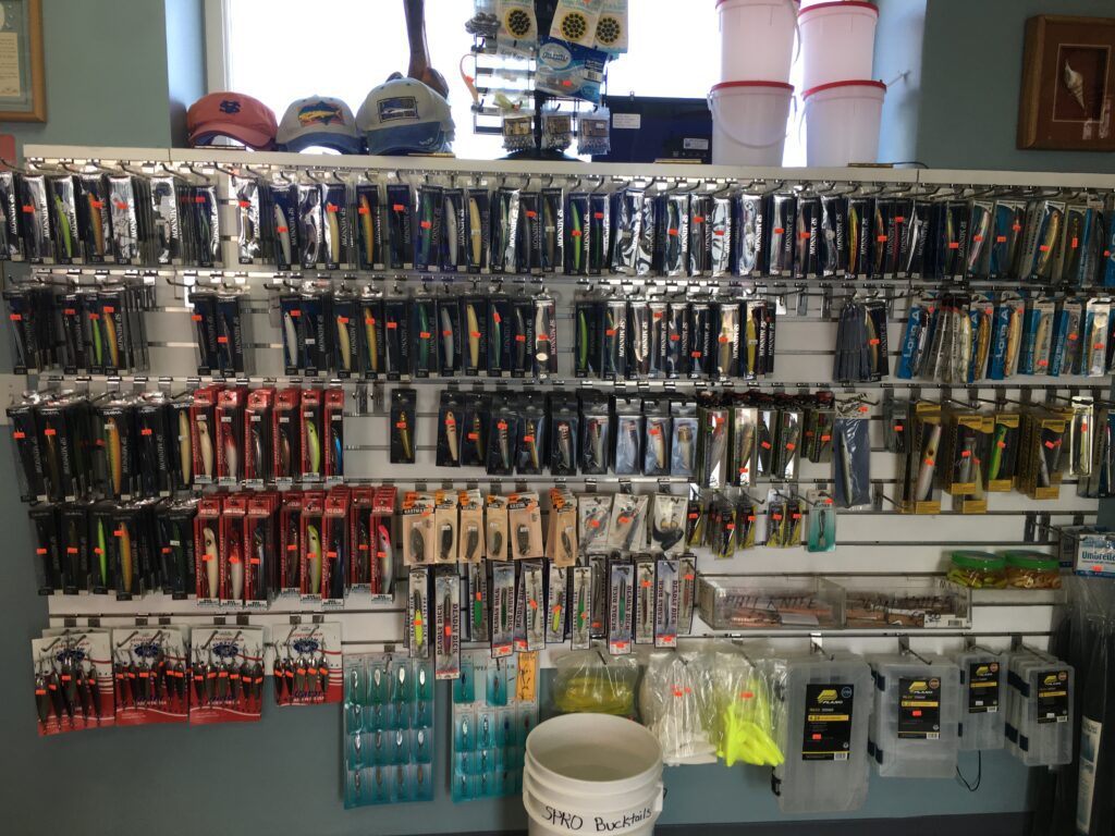 A shelf with different kinds of fishing items