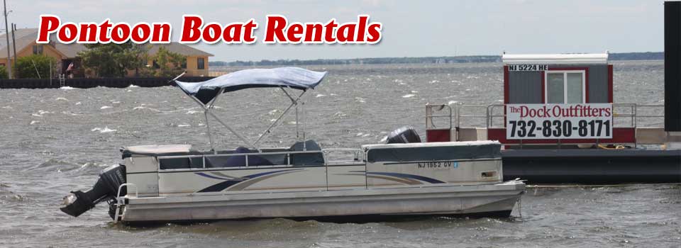 Pontoon boat docked for rentals on a calm lake.