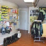 A showroom of safety gear including gloves, boots, and jackets.