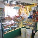 Interior of a bakery with display cases filled with pastries and cakes.
